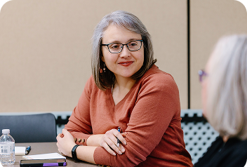 A woman working with other City employees.