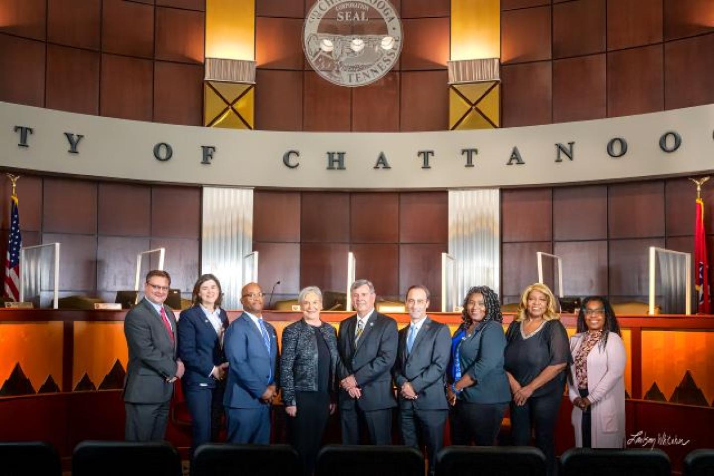 Group photo of Chattanooga City Council members, including Darrin Ledford, Jenny Hill, Isiah Hester, Carol Berz, Chip Henderson, Ken Smith, Raquetta Dotley, Marvene Noel, and Demetrus Coonrod.