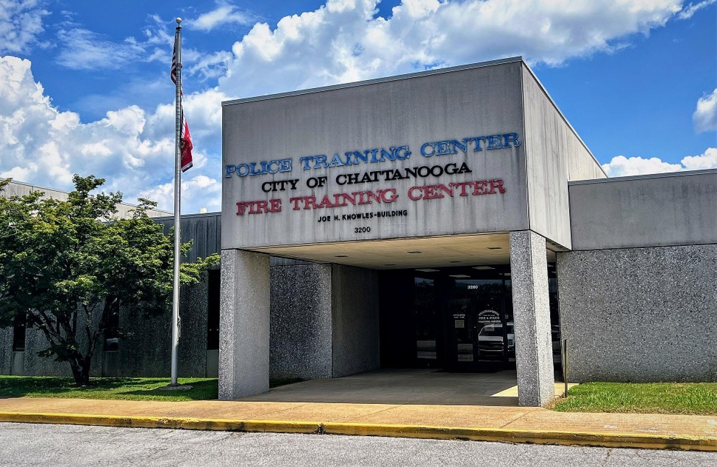 Exterior of the Police Training Center, City of Chattanooga Fire Training Center building under a blue sky with clouds.