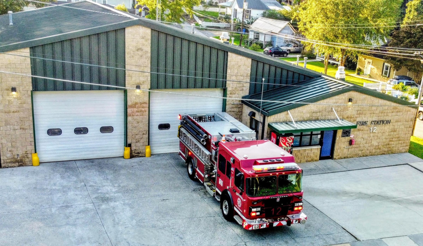 Fire truck parked in front of building at fire station 12.