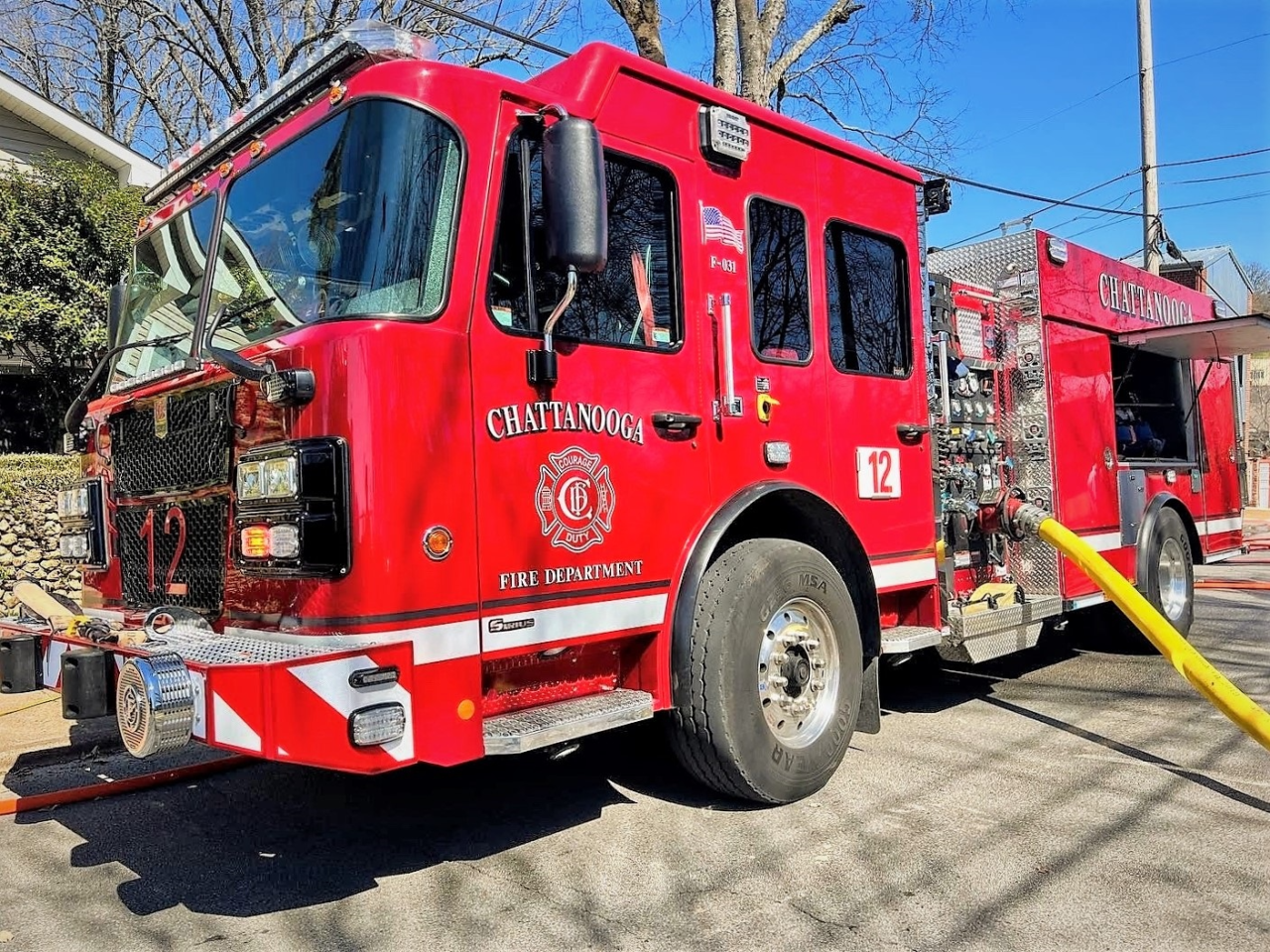 Fire truck parked on side of road near Fire Station 12.