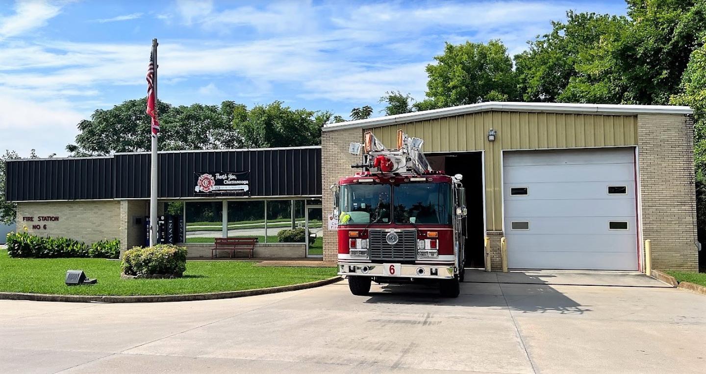 Fire truck parked in front of building at fire station 6.