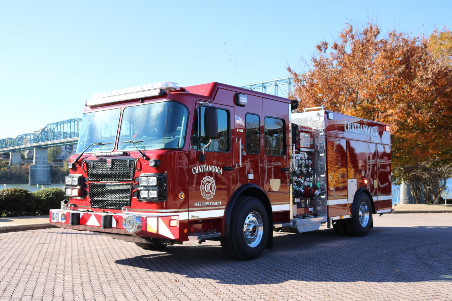 Side view of a red fire truck parked at fire station 9.