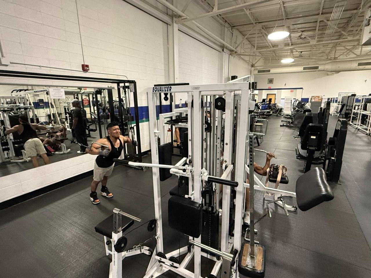 People using weight machines