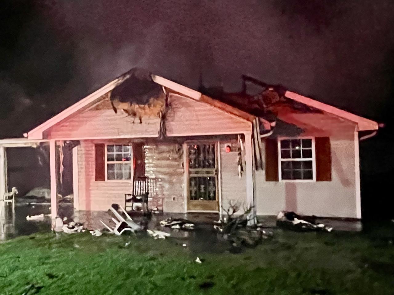 Close up view of house with burned roof