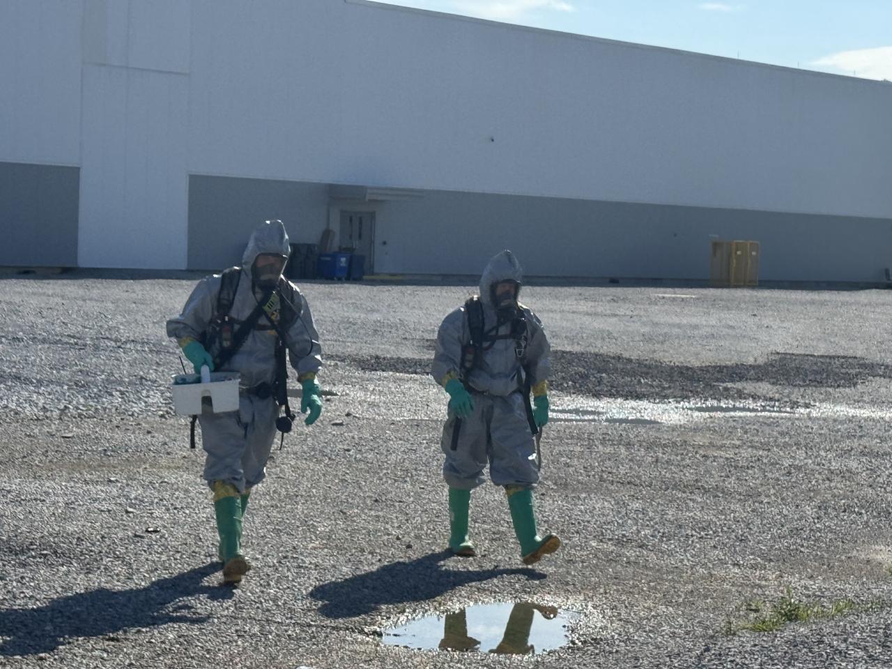 Two Hazmat Officers walking