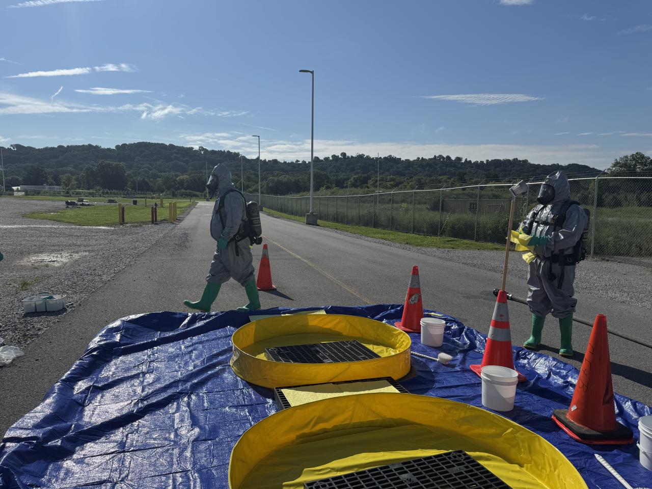 Hazmat officers heading into the situation