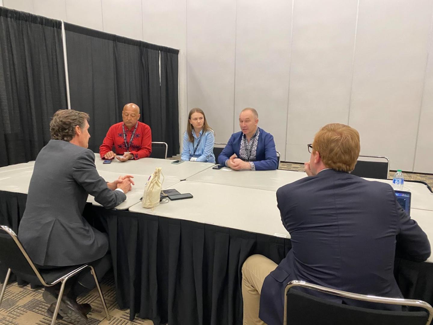 Mayor Kelly, United States Agency for International Development representatives, and city staff discuss a potential partnership with Trostyanets.