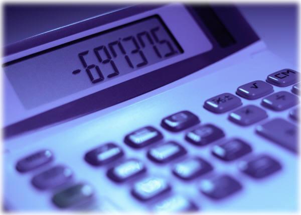 Blue-toned close-up of a calculator with the display showing negative numbers.