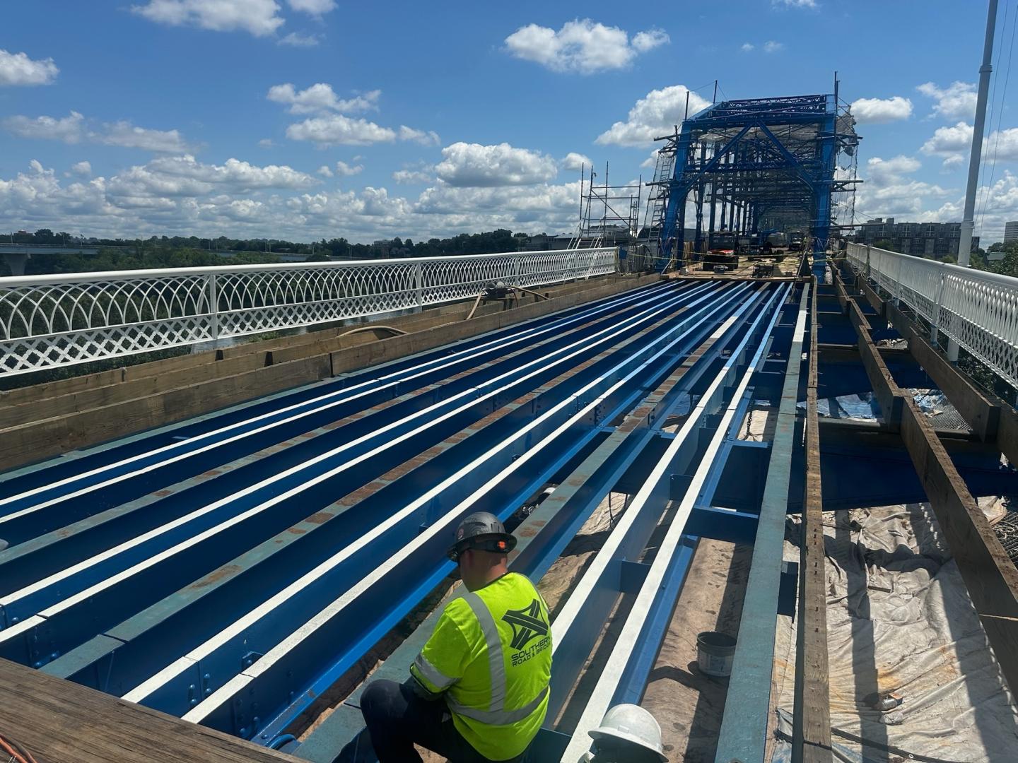Rows of steel structural supports being placed on the bridge